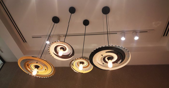 Each Nespresso store features a design elment that is original to the country it is in. In SA it is these local lampshades